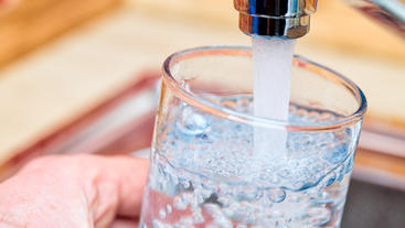 Water pouring from a faucet